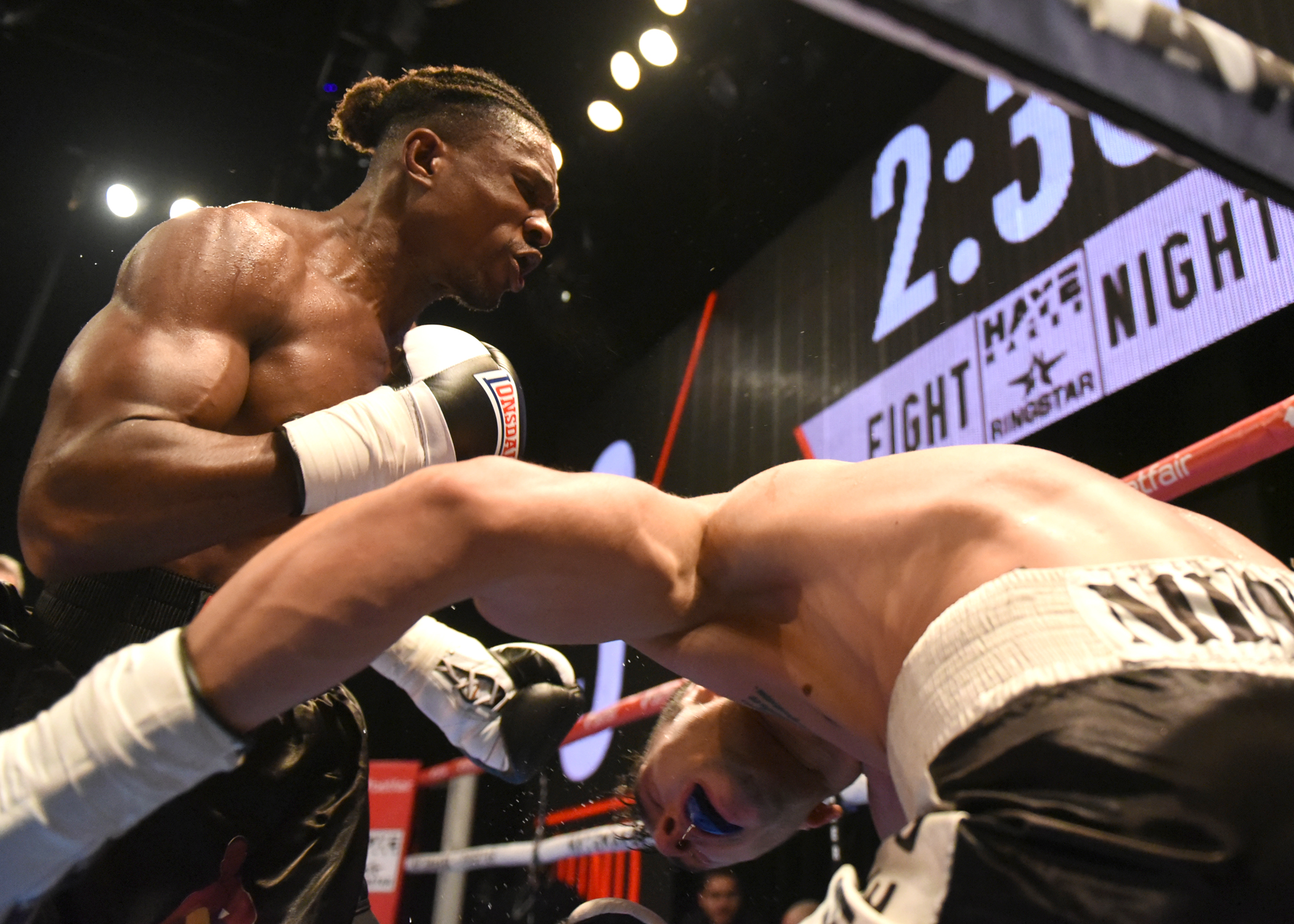 Tunji Ogunniya digging a punch to the body